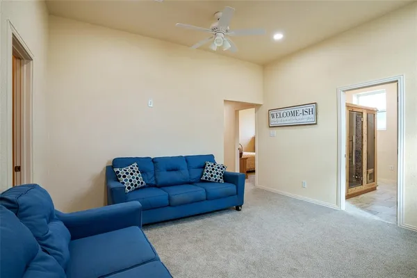 a living room with furniture a couch and a window