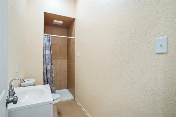 a bathroom with a sink and toilet