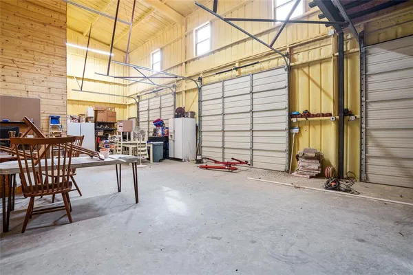 a view of a chairs and table in the room