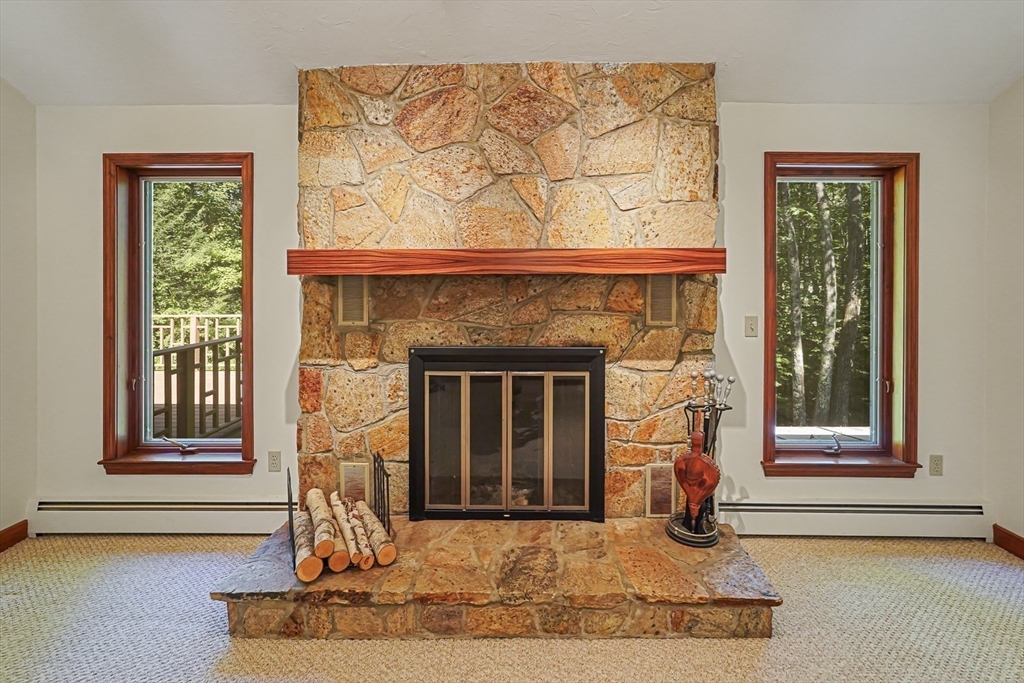 165 Barre Paxton Road Rutland, MA 01543 - Photo 25 of 42 a front view of a house with fireplace