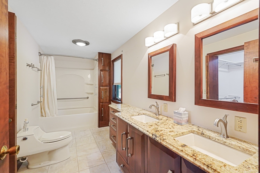 165 Barre Paxton Road Rutland, MA 01543 - Photo 31 of 42 a bathroom with a granite countertop sink toilet and shower