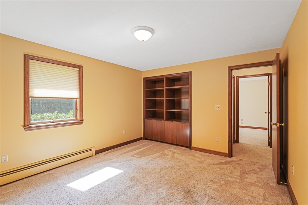 165 Barre Paxton Road Rutland, MA 01543 - Photo 34 of 42 an empty room with windows and closet