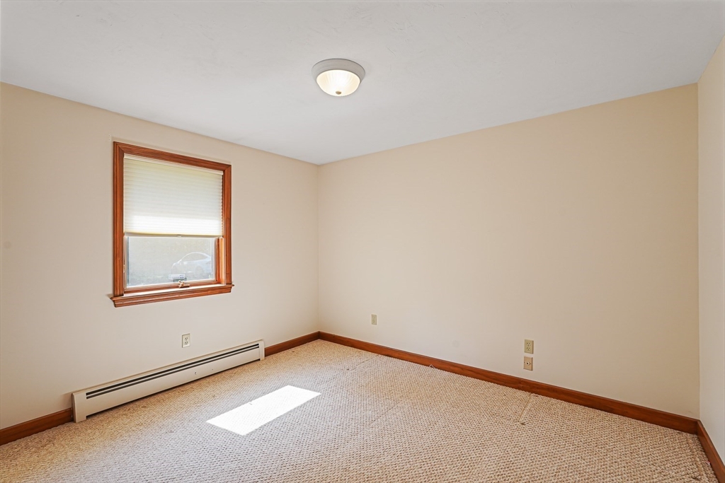 165 Barre Paxton Road Rutland, MA 01543 - Photo 35 of 42 an empty room with a window