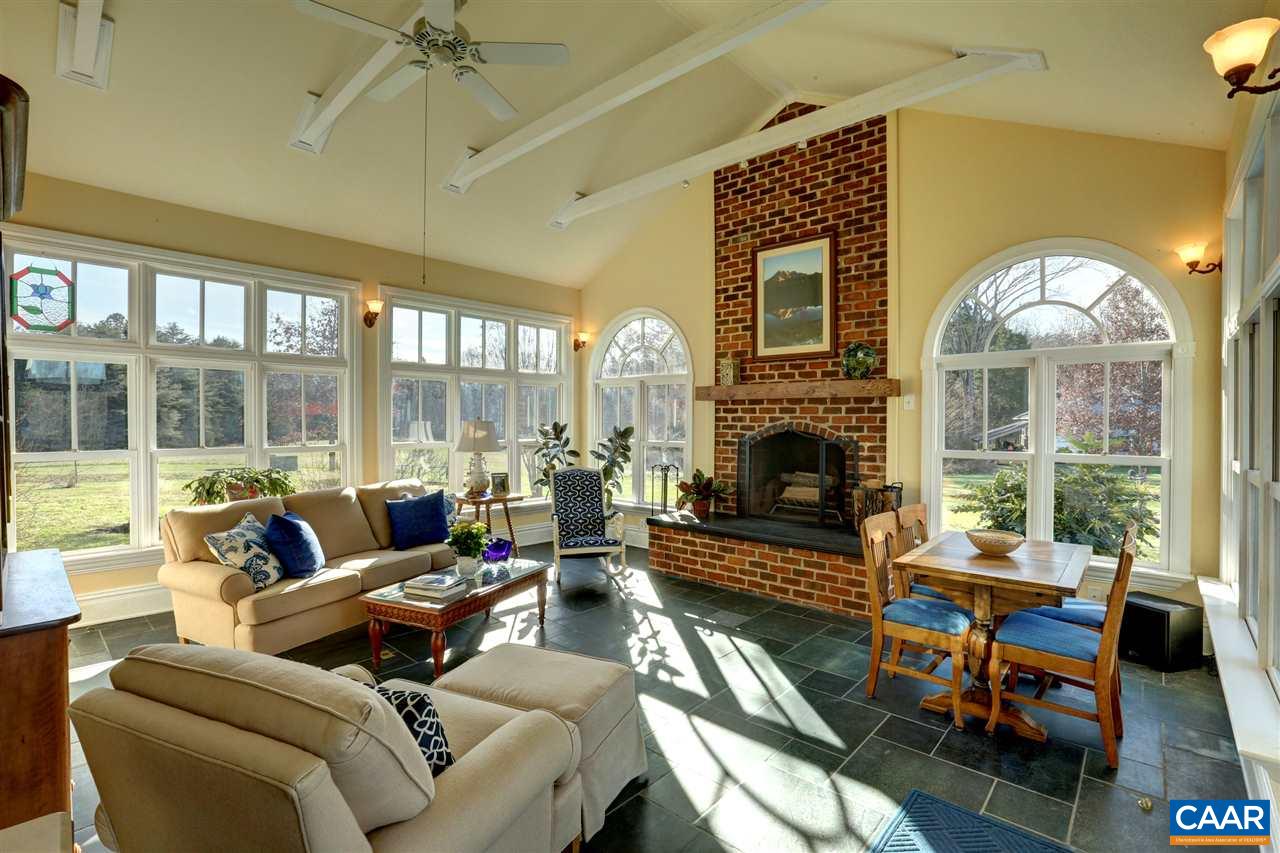5342 Duval Road Kents Store, VA 23084 - Photo 20 of 40 a living room with furniture fireplace and a large window