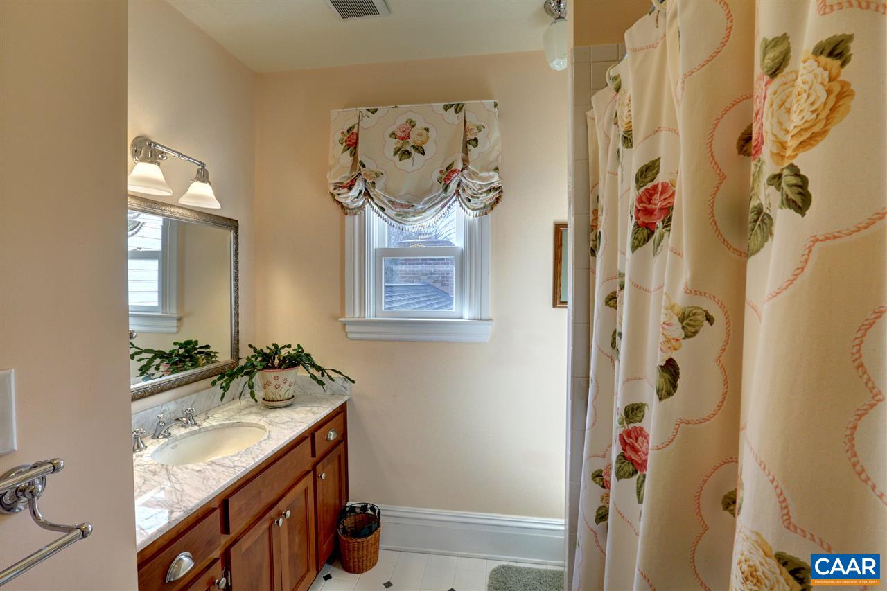 5342 Duval Road Kents Store, VA 23084 - Photo 25 of 40 a bathroom with a granite countertop shower a sink and a mirror