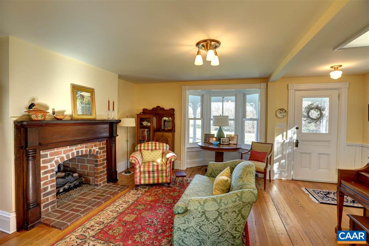 5342 Duval Road Kents Store, VA 23084 - Photo 6 of 40 a living room with furniture and a fireplace