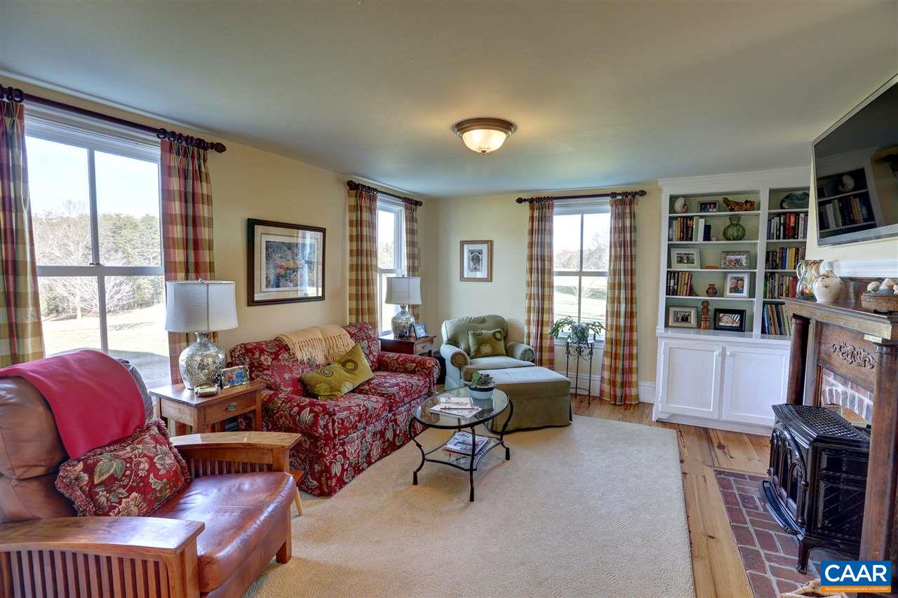 5342 Duval Road Kents Store, VA 23084 - Photo 10 of 40 a living room with furniture large window and flat screen tv