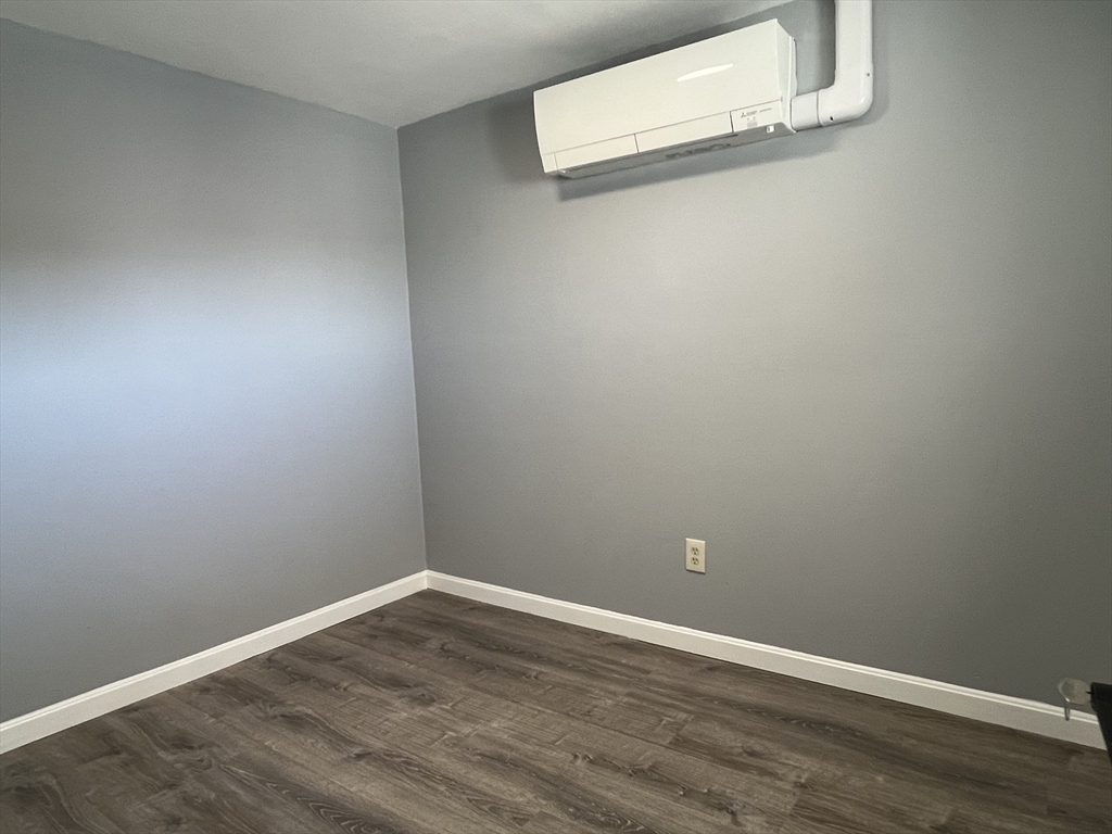 99 Chelsea Street, Unit 3 Boston, MA 02128 - Photo 6 of 10 a view of a room with wooden floor
