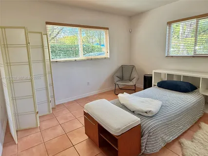 a bedroom with a bed and cabinets