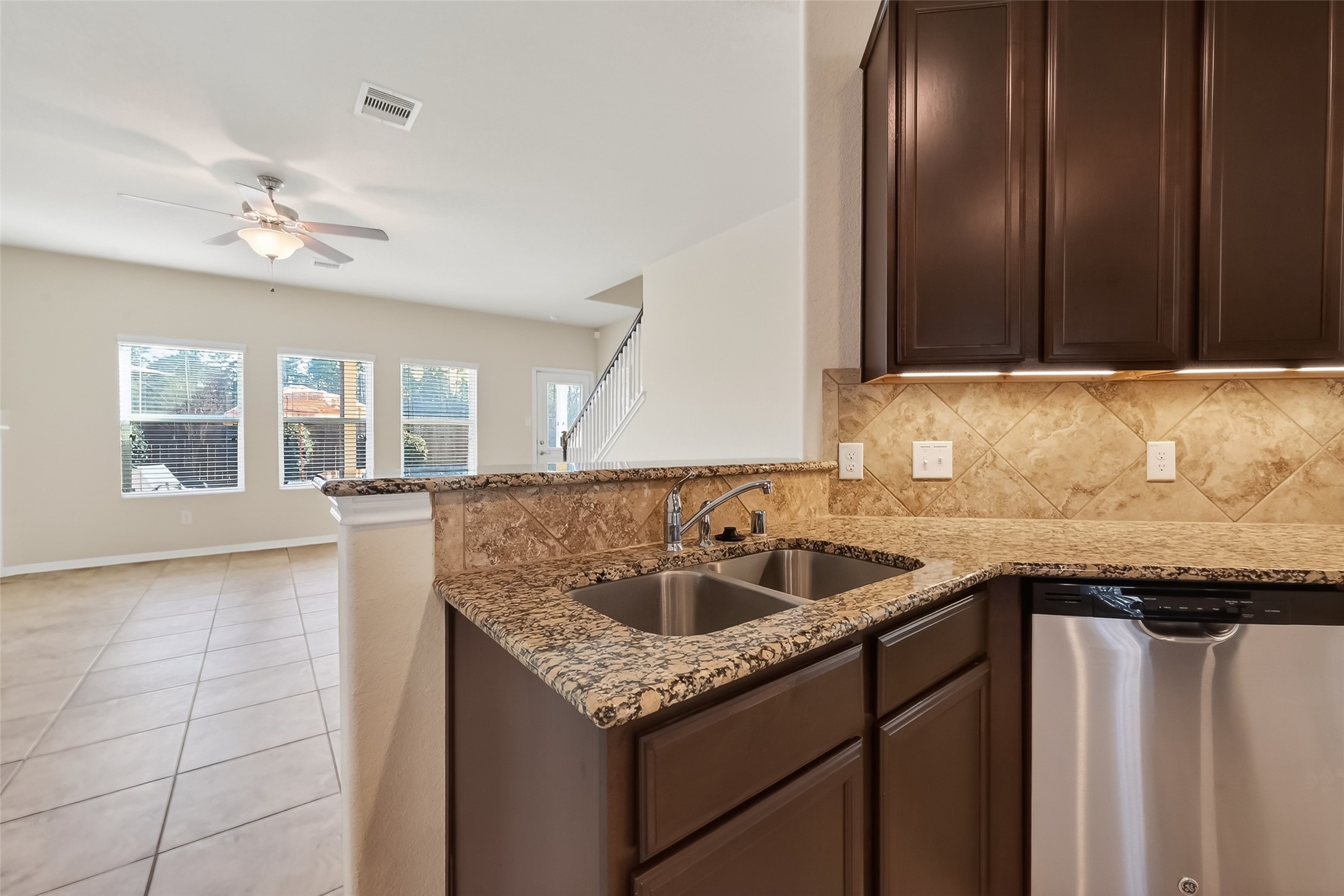 2672 Magnolia Fair Way Spring, TX 77386 - Photo 14 of 49 Kitchen sink positioned to overlook the living room for an open, connected feel.