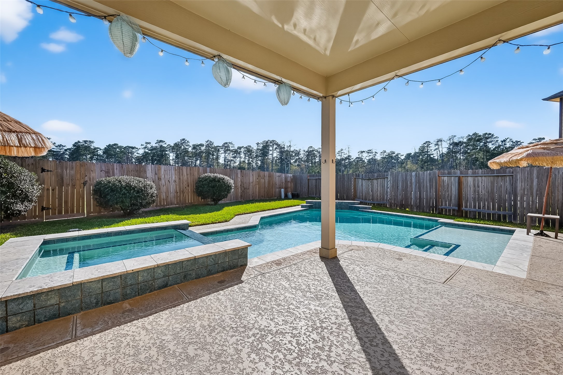 2672 Magnolia Fair Way Spring, TX 77386 - Photo 2 of 49 Enjoy stunning sunsets from your spacious covered patio in the backyard oasis.