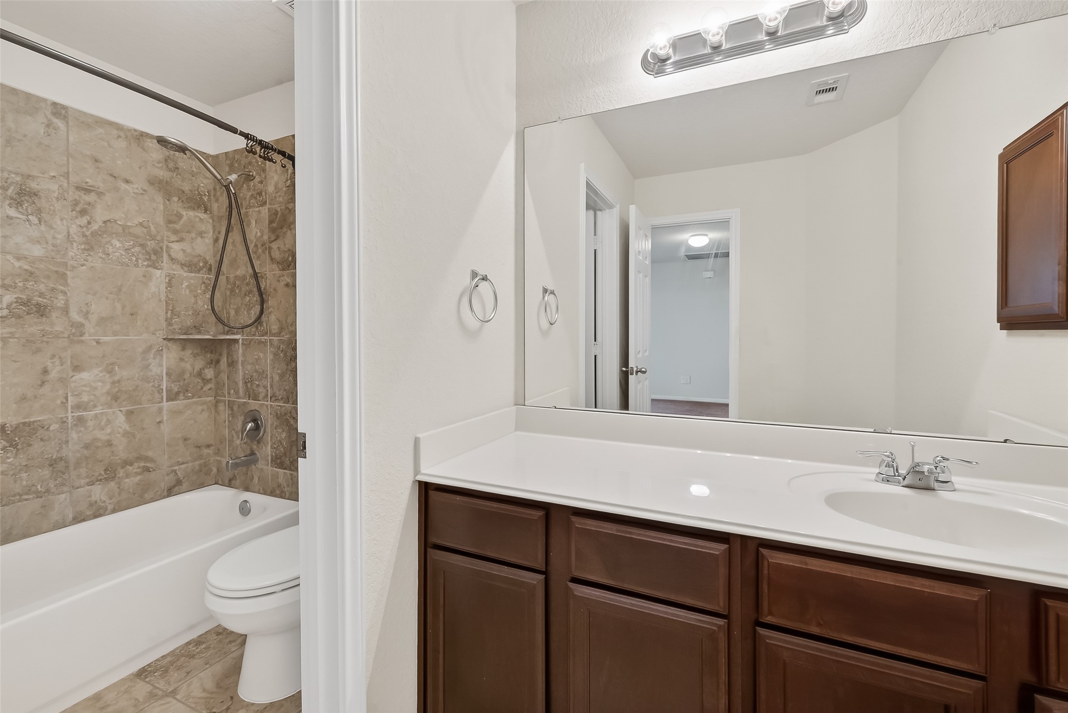 2672 Magnolia Fair Way Spring, TX 77386 - Photo 37 of 49 Experience comfort and style in this upstairs bathroom, featuring elegant tile work and ample counter space.