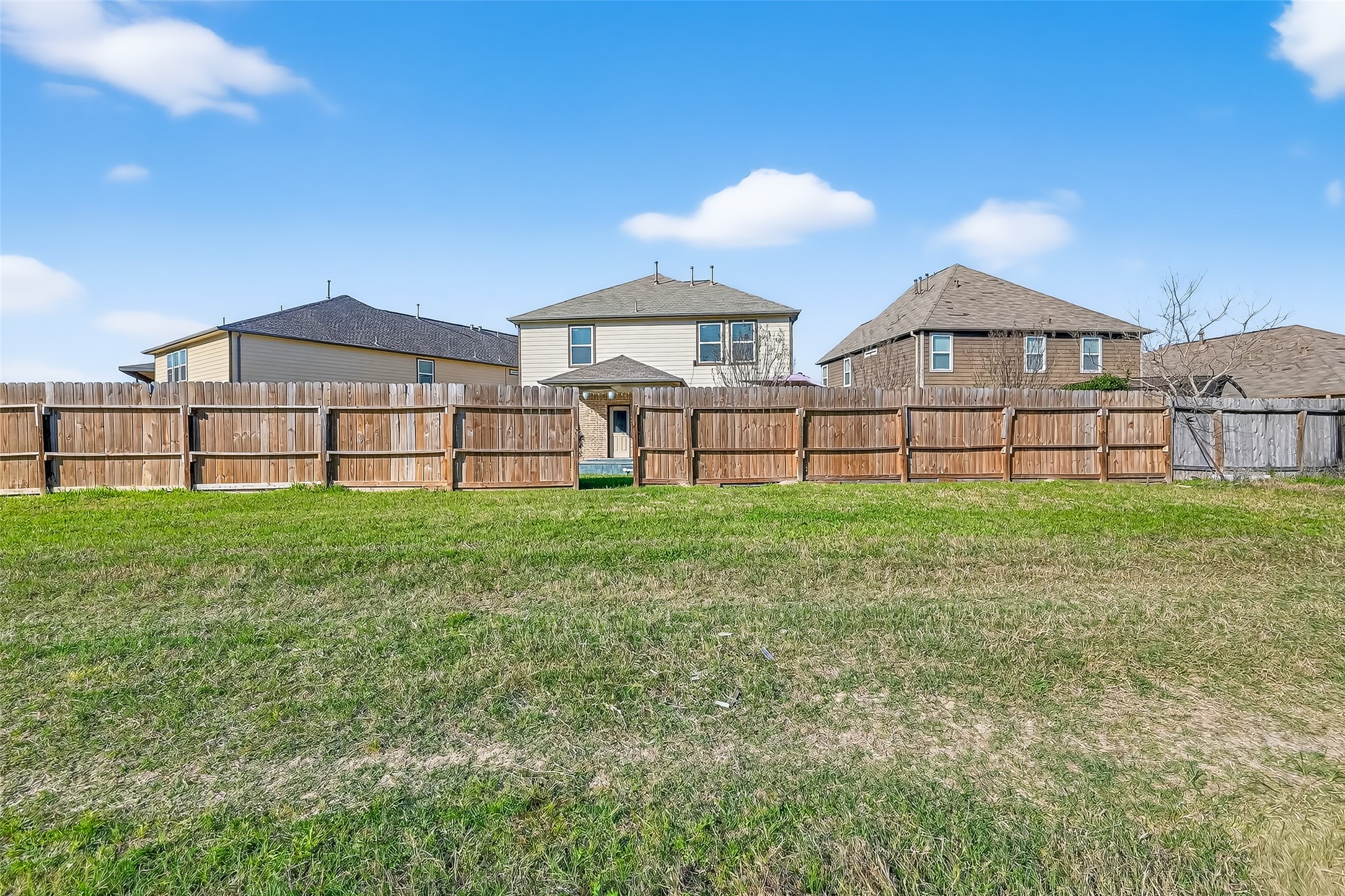 2672 Magnolia Fair Way Spring, TX 77386 - Photo 41 of 49 A spacious, open area behind the home offers privacy and potential for outdoor enjoyment.