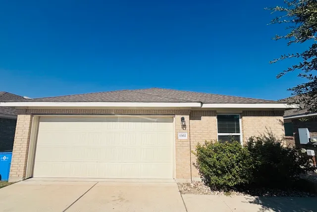 a view of a house with a garage