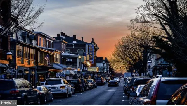 a front view of a building with a yard