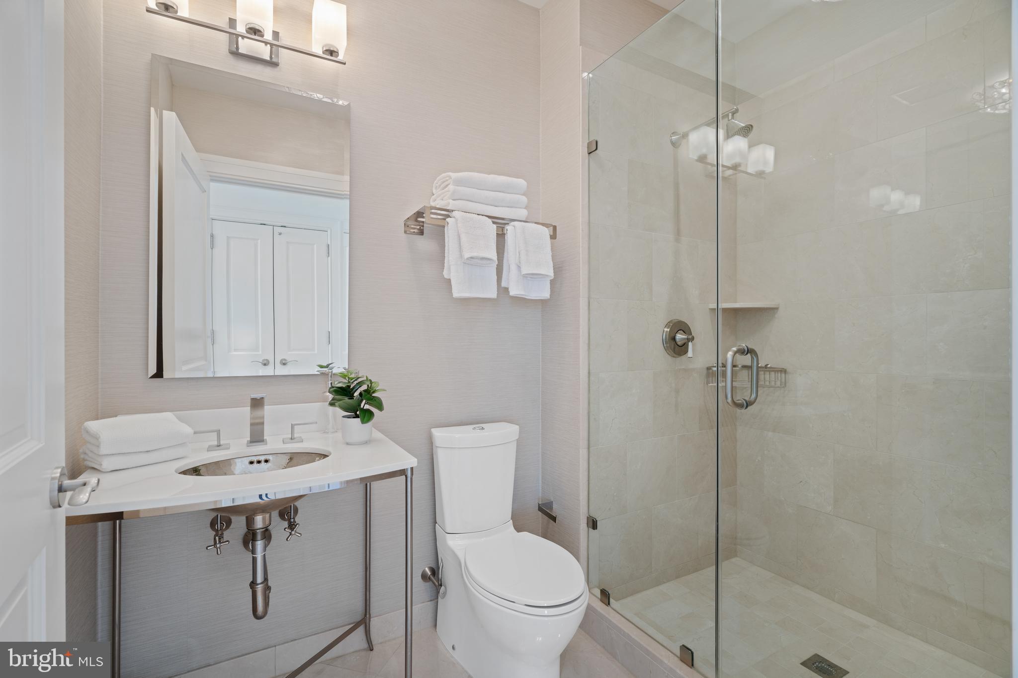 130 South 18th Street, Unit 1602 Philadelphia, PA 19103 - Photo 23 of 52 a bathroom with a sink a toilet and shower