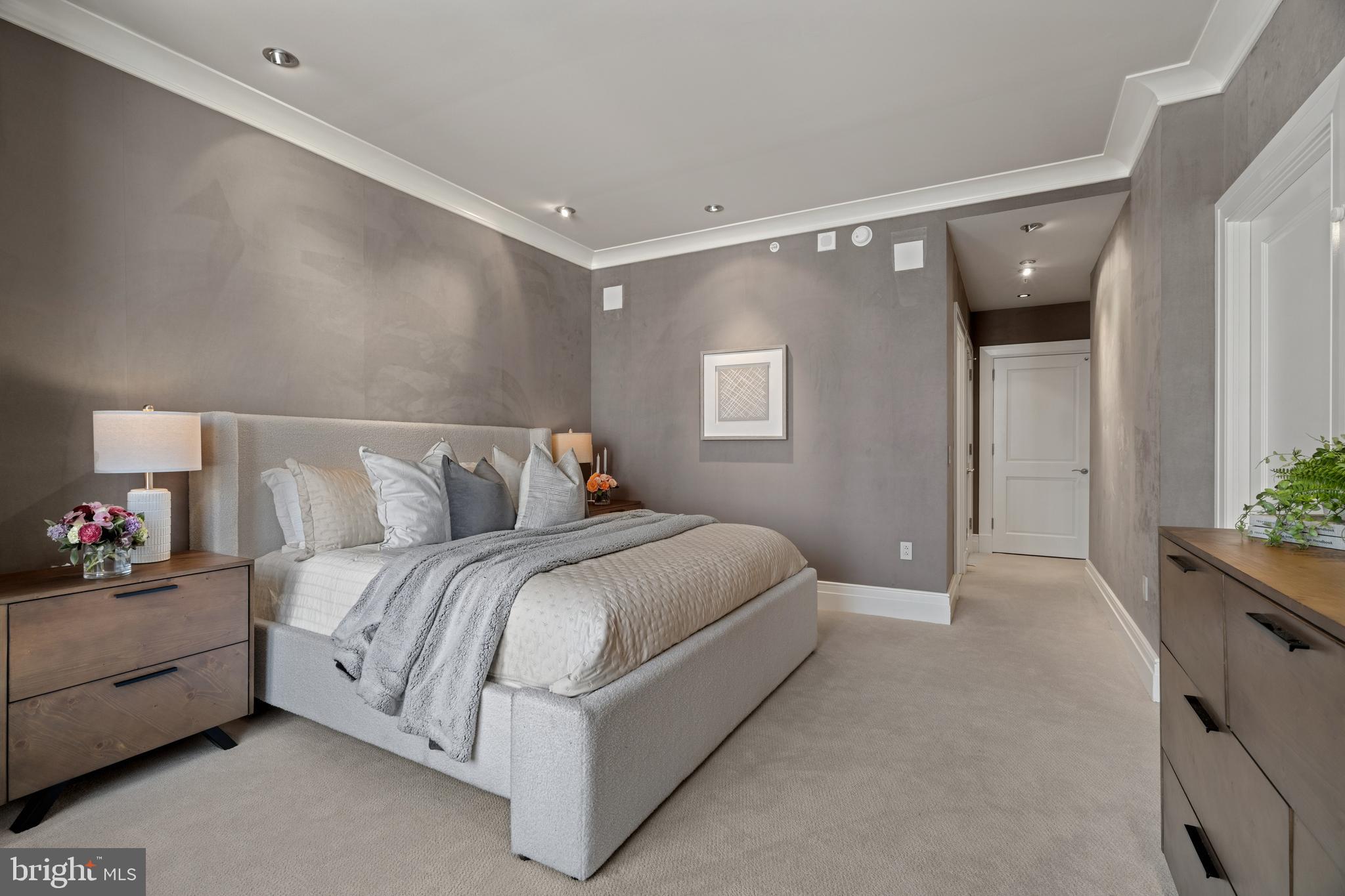 130 South 18th Street, Unit 1602 Philadelphia, PA 19103 - Photo 32 of 52 a spacious bedroom with a bed and a couch