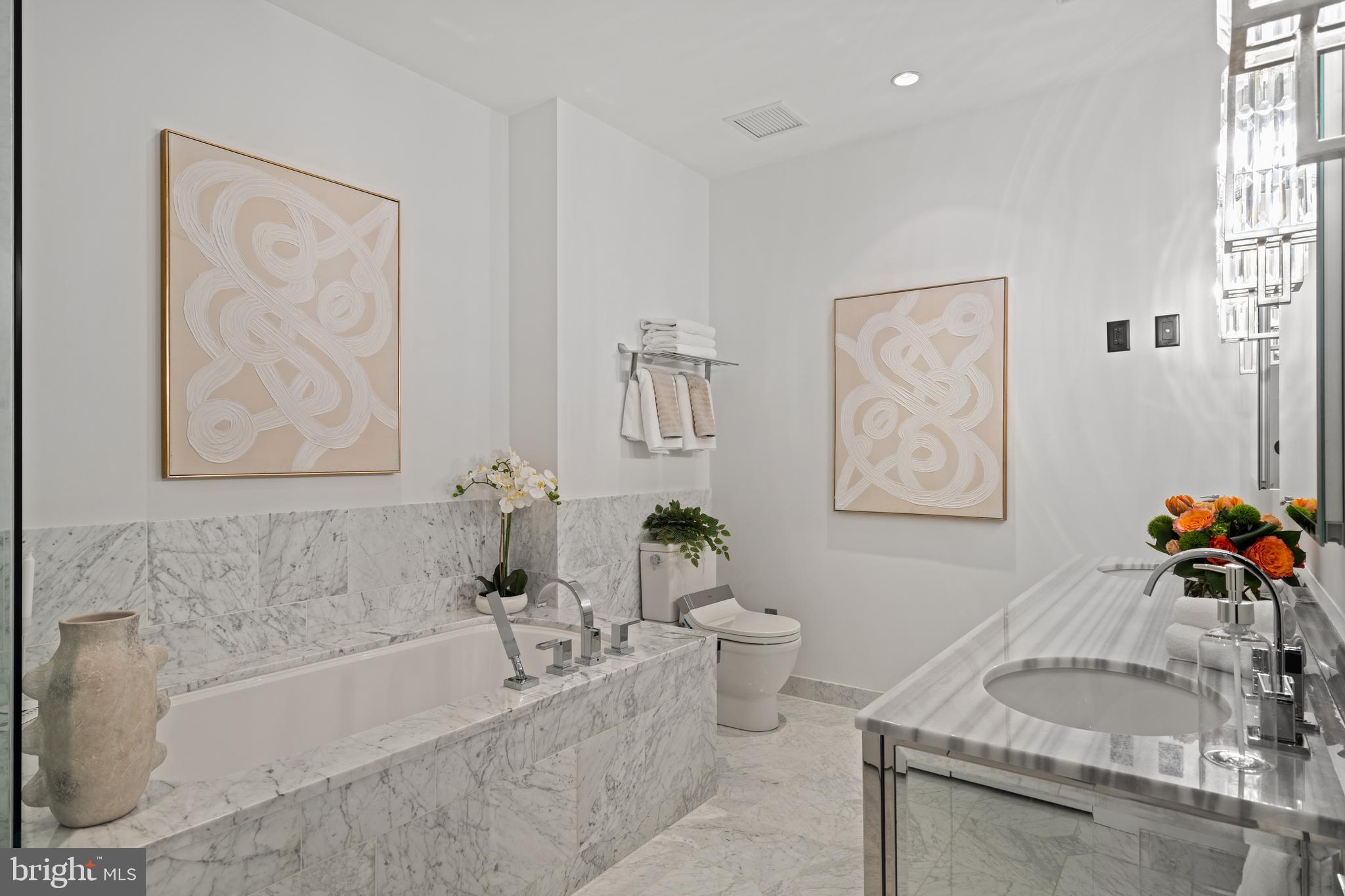 130 South 18th Street, Unit 1602 Philadelphia, PA 19103 - Photo 36 of 52 a bath room with a bath tub and a sink