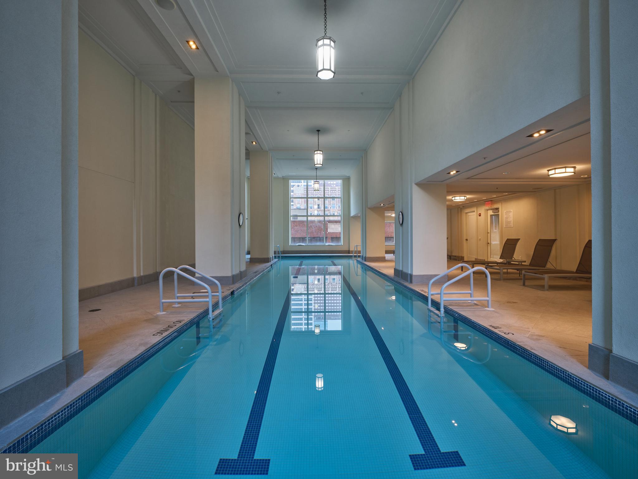 130 South 18th Street, Unit 1602 Philadelphia, PA 19103 - Photo 39 of 52 a large pool with table & chairs in it
