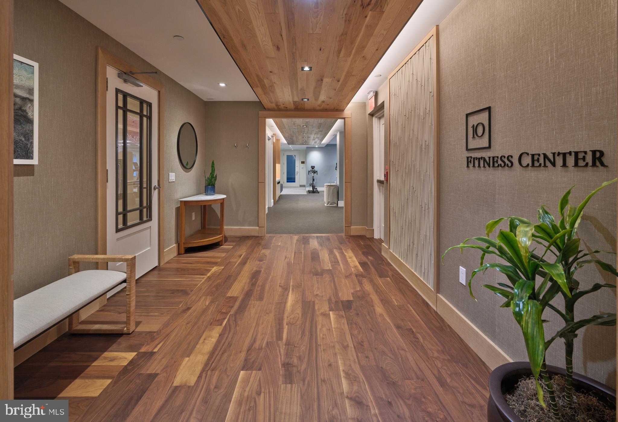 130 South 18th Street, Unit 1602 Philadelphia, PA 19103 - Photo 46 of 52 a view of a hallway with wooden floor and furniture