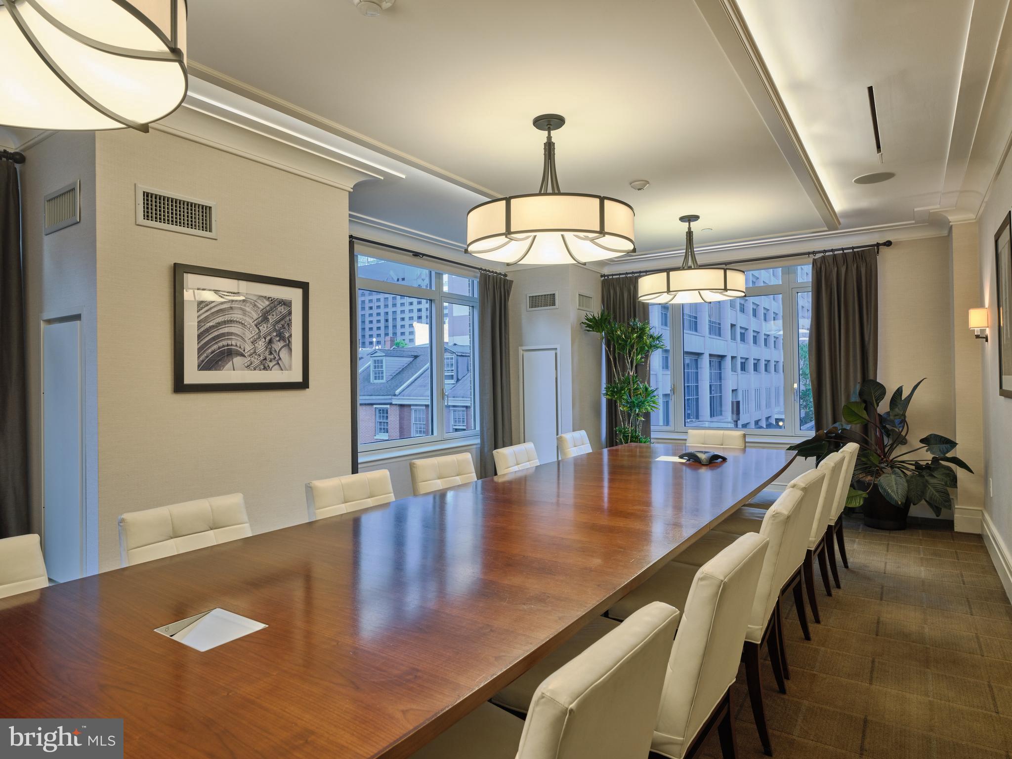 130 South 18th Street, Unit 1602 Philadelphia, PA 19103 - Photo 48 of 52 a view of a dining room with furniture a chandelier and wooden floor