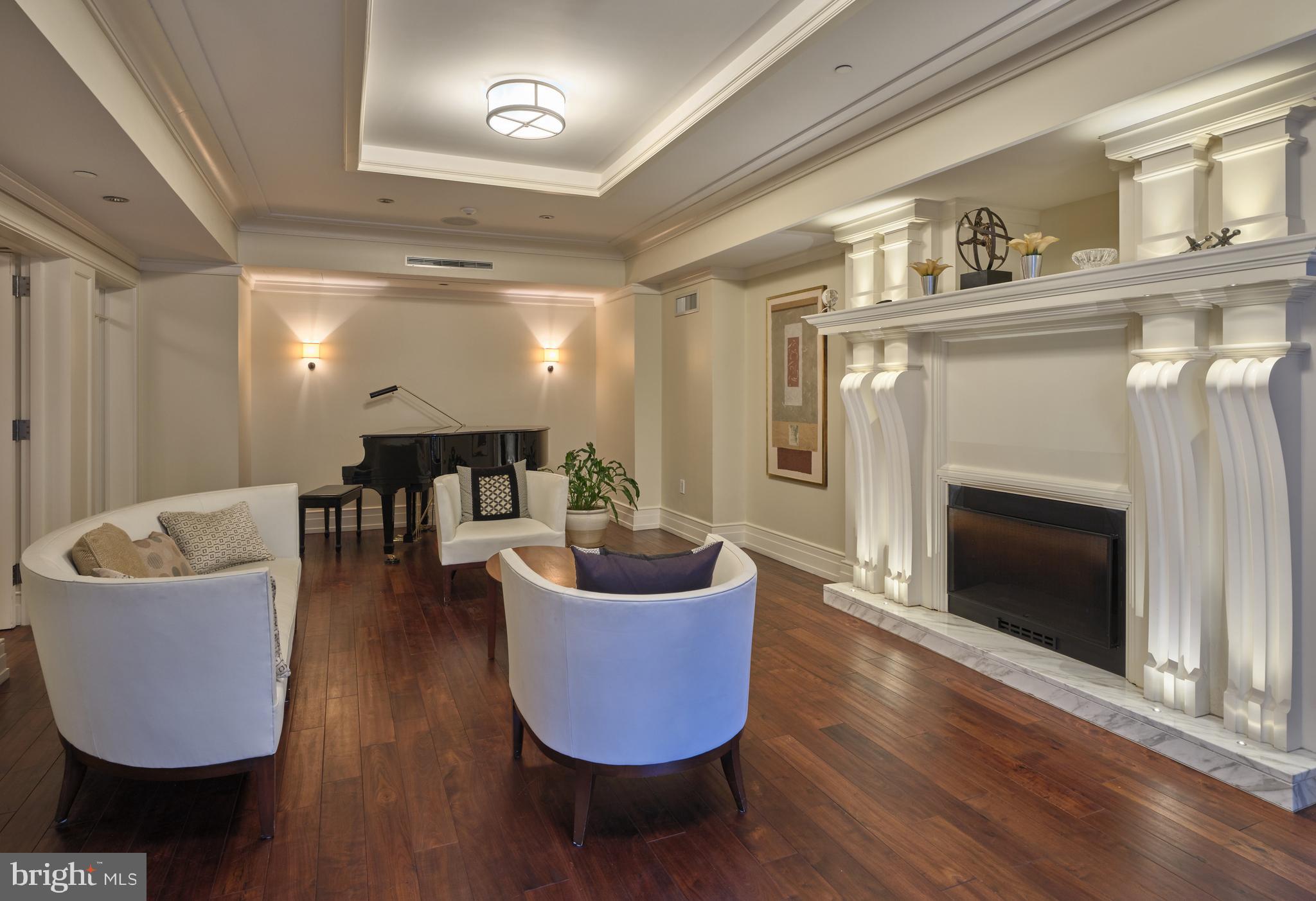 130 South 18th Street, Unit 1602 Philadelphia, PA 19103 - Photo 49 of 52 a living room with furniture and a fireplace