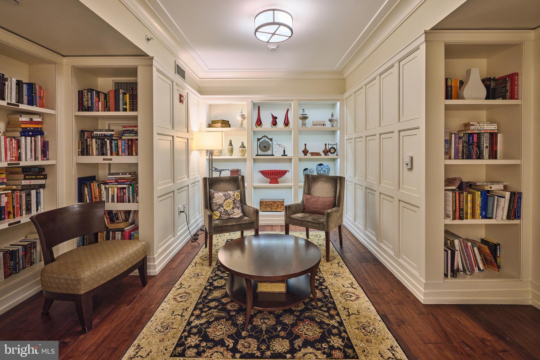 130 South 18th Street, Unit 1602 Philadelphia, PA 19103 - Photo 51 of 52 a living room with furniture and a book shelf