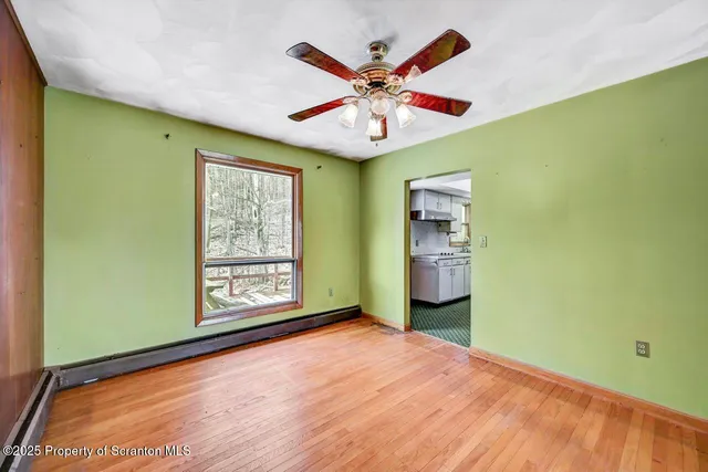 a view of an empty room with a window