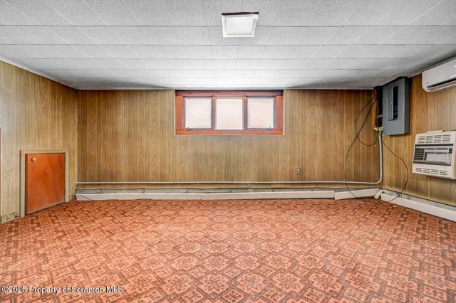 a backyard of a house with wooden floor chairs and wooden floor