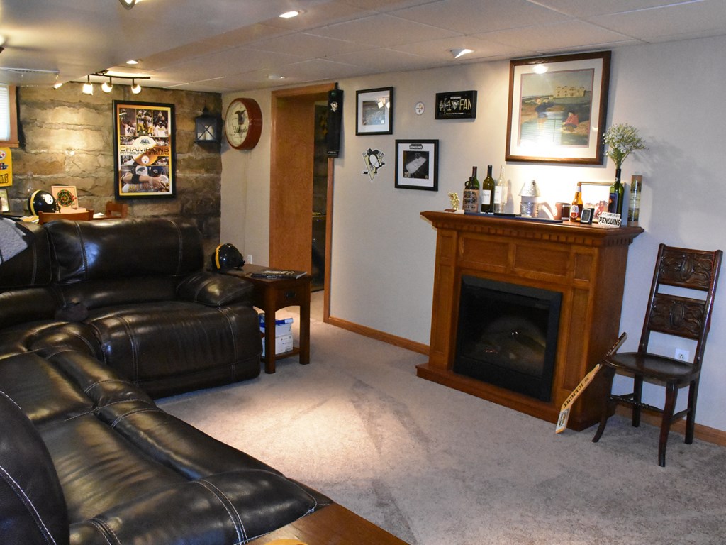 655 Chestnut Street Meadville, PA 16335 - Photo 19 of 43 a living room with furniture and a fireplace