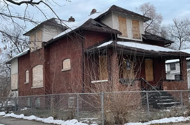 a front view of a house with garage
