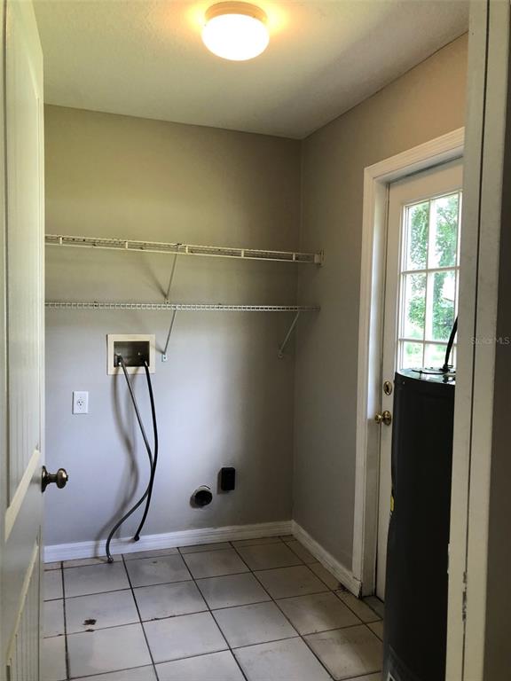 2406 South Maple Avenue Sanford, FL 32771 - Photo 12 of 12 a room with gym equipment and a glass window shower