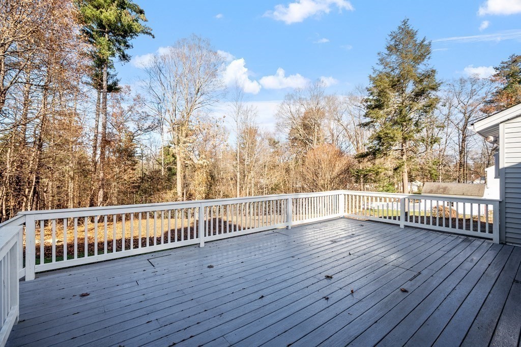 185 Sterling Road Lancaster, MA 01523 - Photo 5 of 42 a view of a balcony with wooden floor and fence
