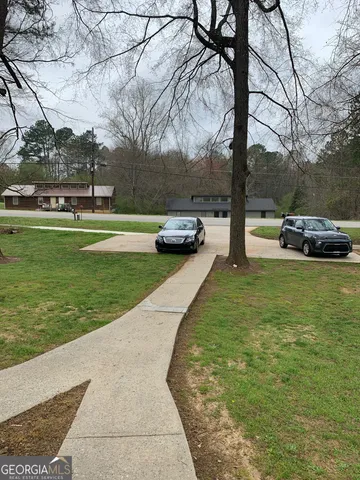 a view of a park with large trees