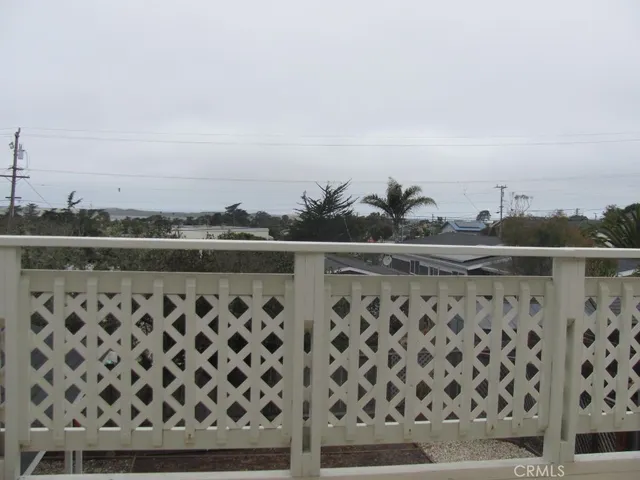 a view of a balcony with an ocean view