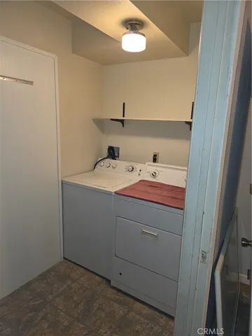 a room with a chair and a rug