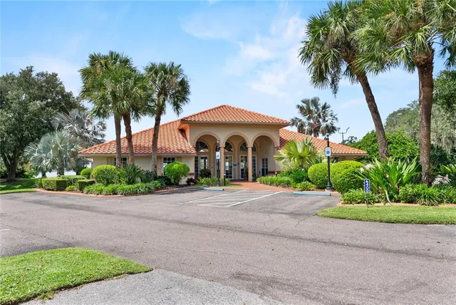a front view of a house with a garden and a yard