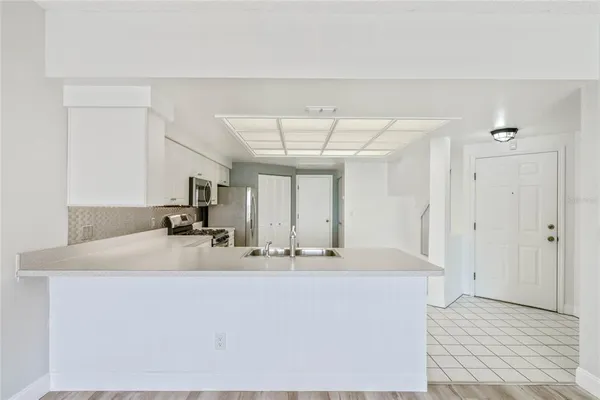 a bathroom with a sink a mirror and window