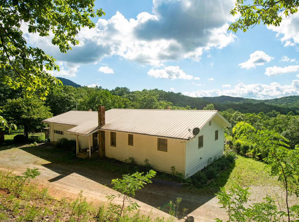 a aerial view of a house with a yard