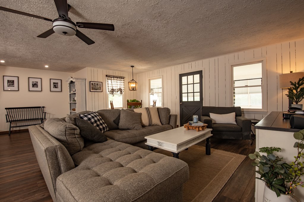 588 Pinetree Road Blue Ridge, GA 30513 - Photo 12 of 54 a living room with furniture kitchen view and a window