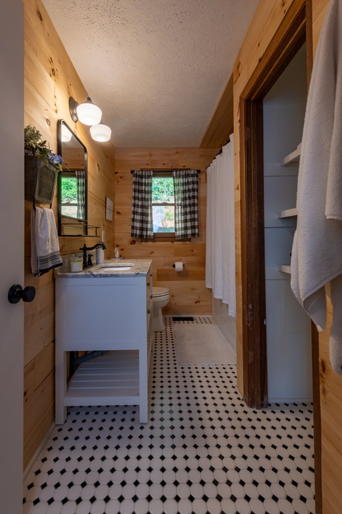 588 Pinetree Road Blue Ridge, GA 30513 - Photo 24 of 54 a room with a large window and chandelier