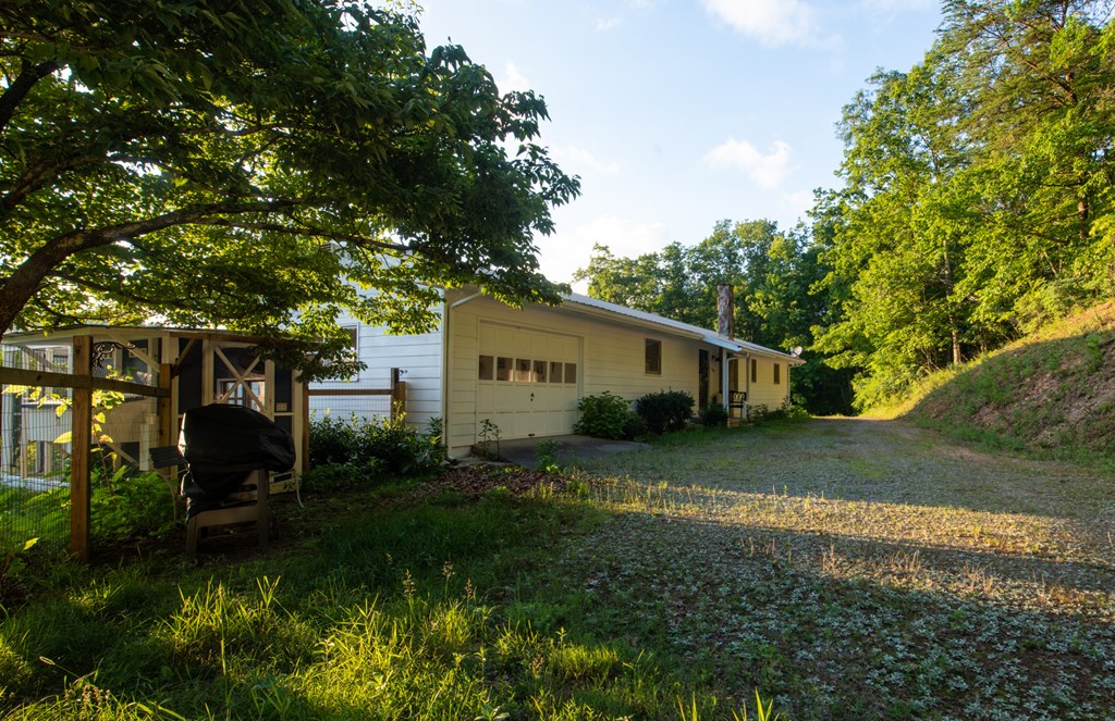 588 Pinetree Road Blue Ridge, GA 30513 - Photo 32 of 54 a view of a house with a yard