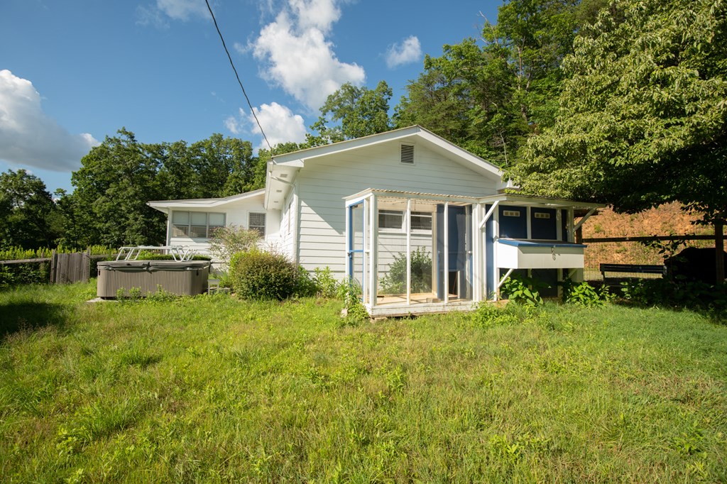 588 Pinetree Road Blue Ridge, GA 30513 - Photo 33 of 54 a front view of a house with garden