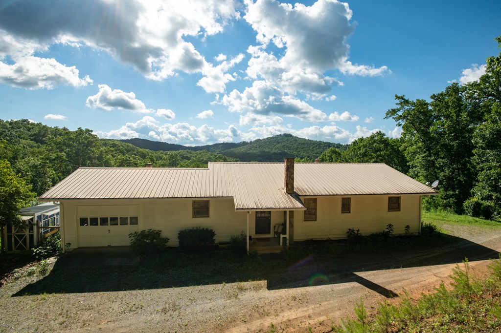 588 Pinetree Road Blue Ridge, GA 30513 - Photo 4 of 54 a front view of a house with garden