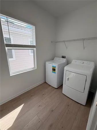 a utility room with dryer and washer