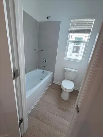 a bathroom with a bathtub and sink
