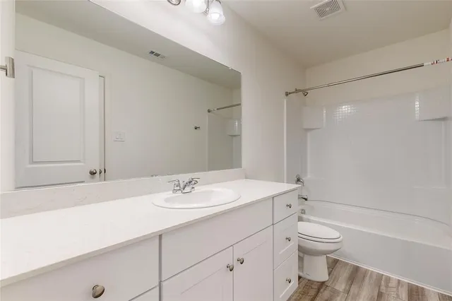 a kitchen with a sink stove and refrigerator