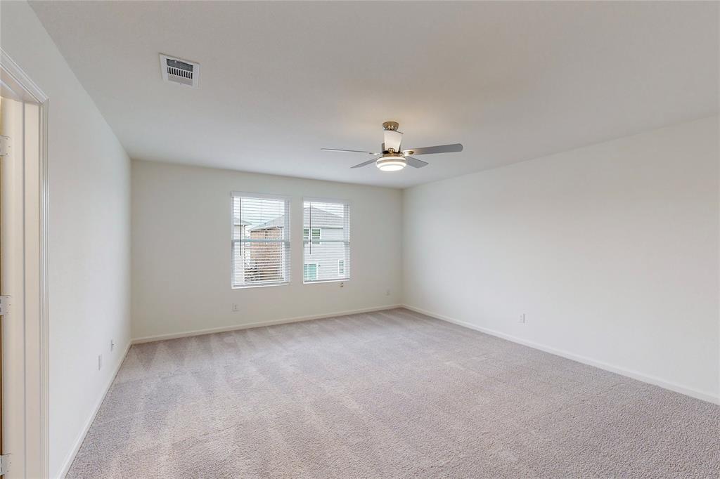 417 Madison Way Princeton, TX 75407 - Photo 14 of 40 Unfurnished room with light carpet and ceiling fan