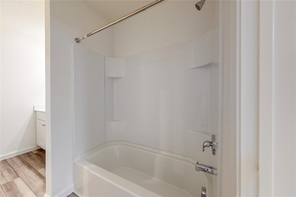 417 Madison Way Princeton, TX 75407 - Photo 21 of 40 Full bath featuring shower / tub combination, vanity, and light wood-style floors