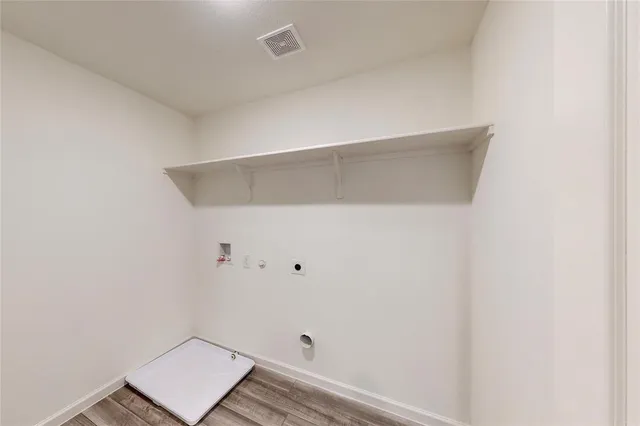 a bathroom with a toilet sink vanity and mirror